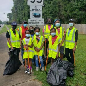 Youth in East Charlotte cleaning adopted street