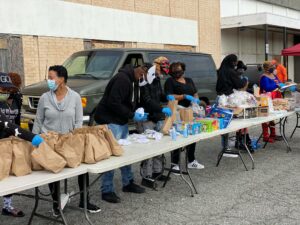 Project BOLT nonprofit volunteers with supplies for community event