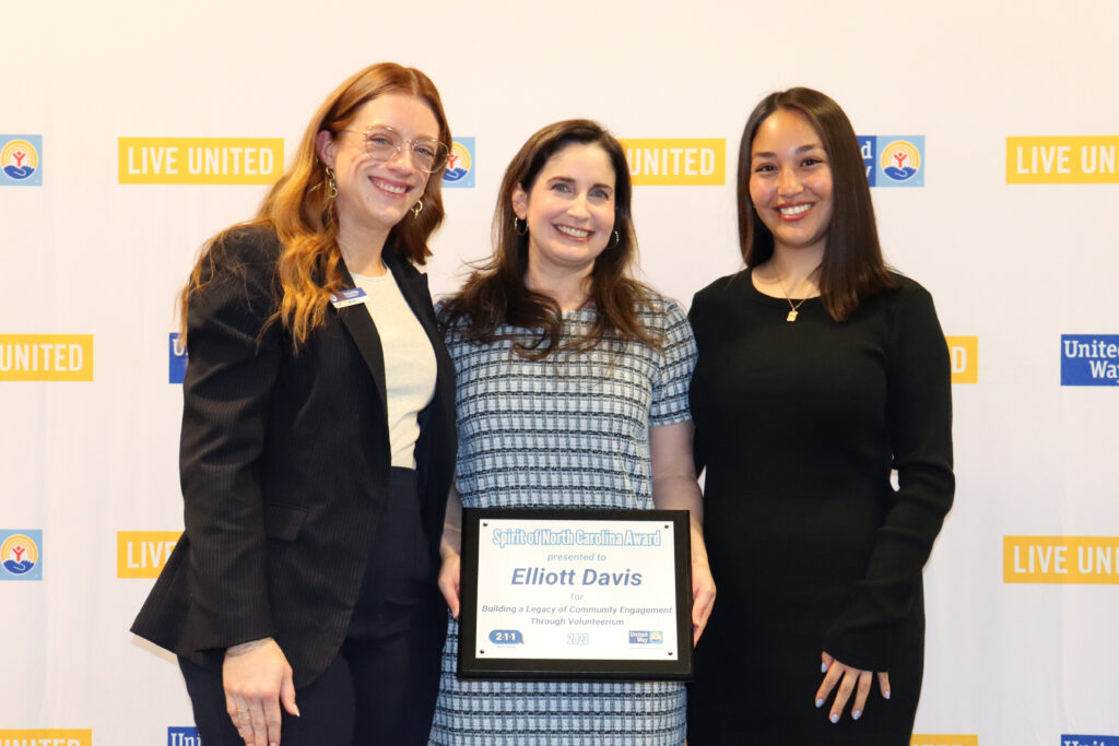 United Way Corporate Relations Manager Kim Savage stands with recipients from Elliott Davis.
